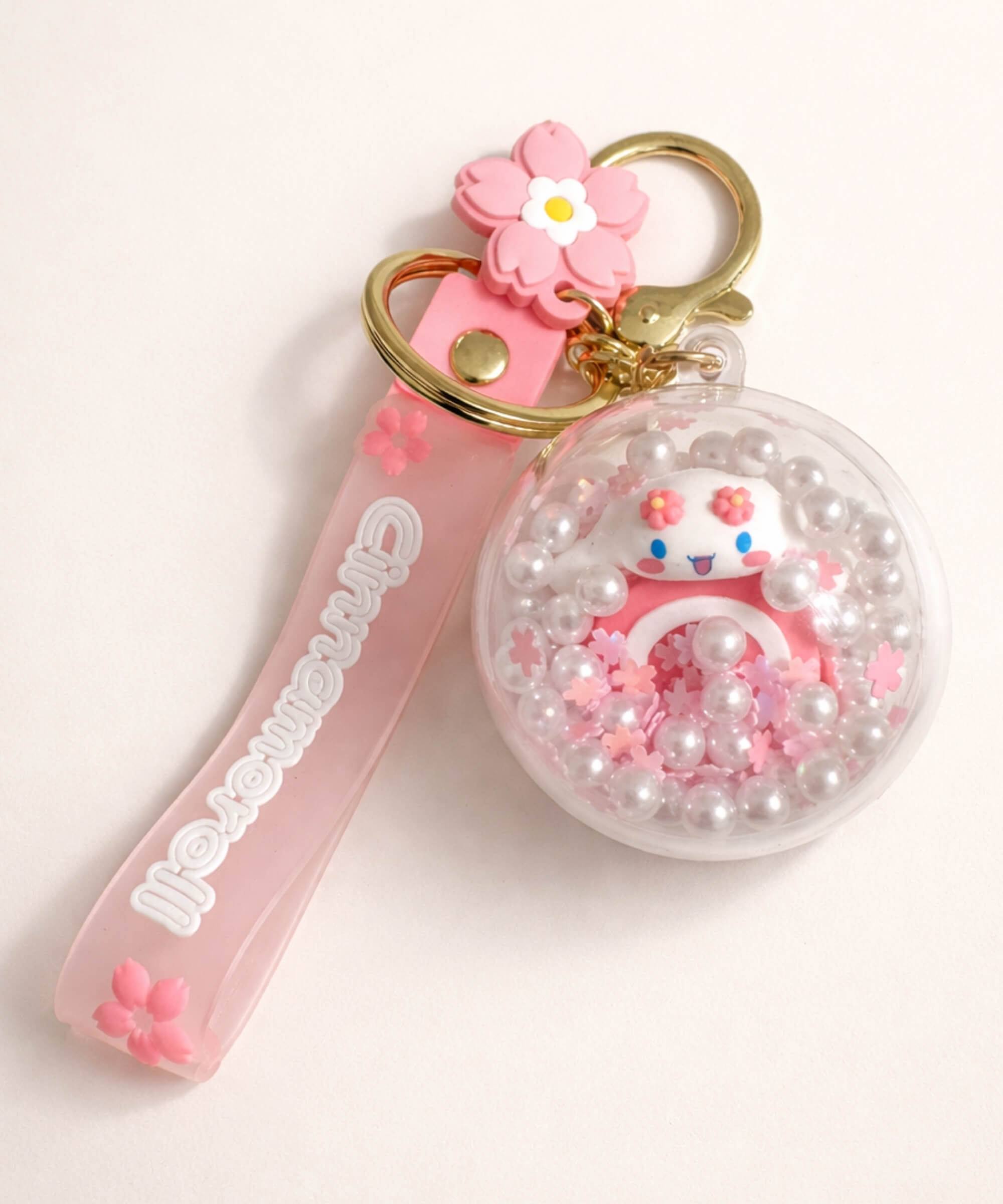 Cinnamoroll bread shaker keychain with floating beads inside clear charm